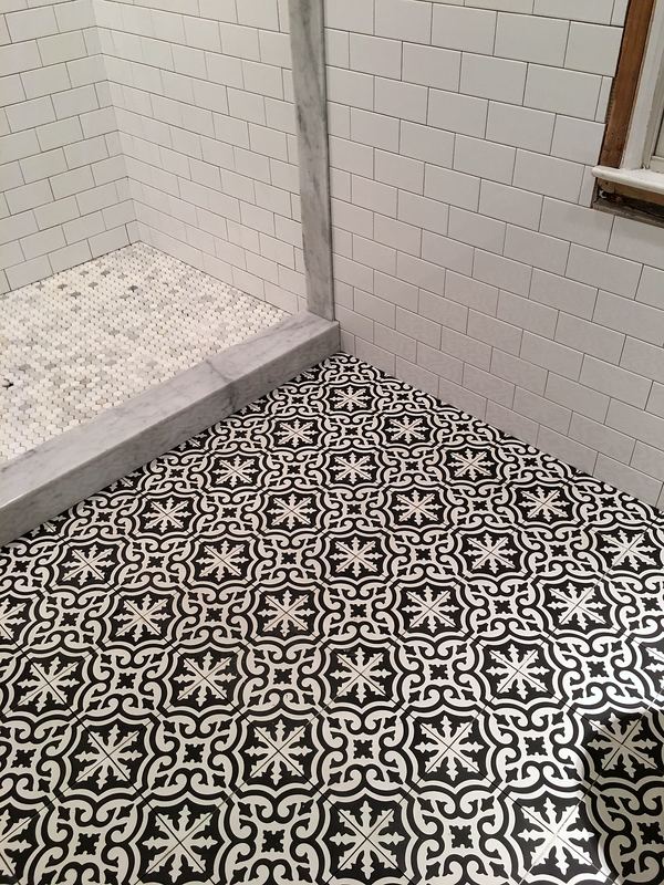 Patterned cement tile shower floor
