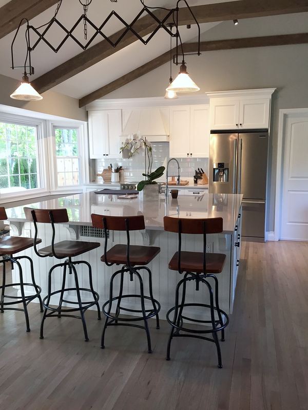 Vaulted kitchen with island seating for four